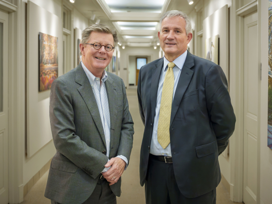 President Price and Mr Bili smile at the camera