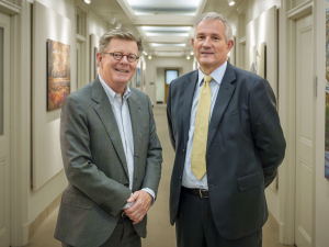 President Price and Mr Bili smile at the camera